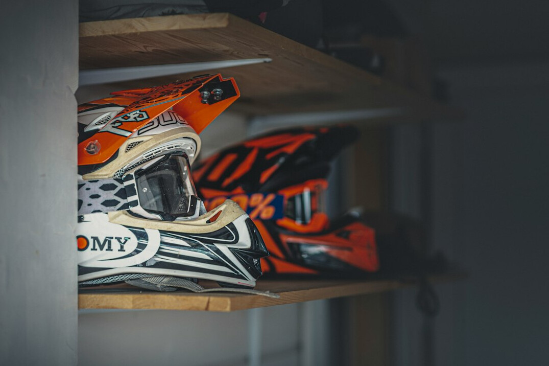 Safety helmets and protective equipment on a shelf